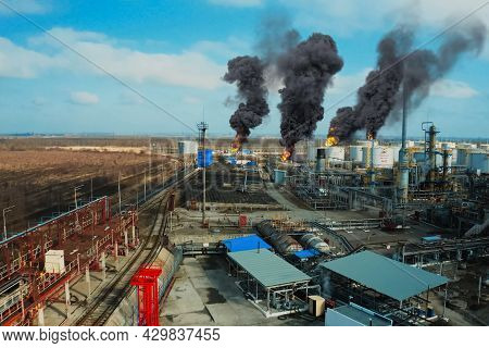 Collage. Fire At The Refinery. Flames And Smoke Of Fire.