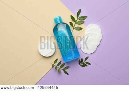 Cotton Pads, Leaves And Makeup Removal Product On Color Background, Flat Lay