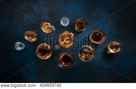Strong Alcohol Drinks, Hard Liquors, Spirits And Distillates Iset In Glasses: Cognac, Scotch, Whiske