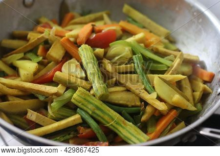 Chopped Vegetables In The Cooking Pan While Cooking For Aviyal, A Popular Kerala Dish