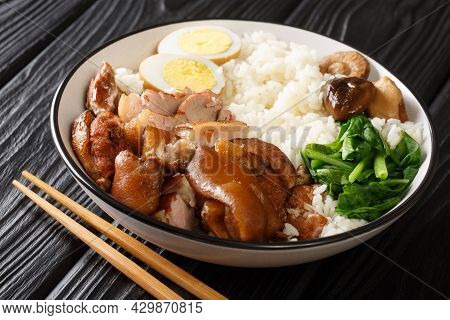 Thai Style Braised Pork Leg On Rice Khao Kha Moo Closeup In The Bowl On The Table. Horizontal