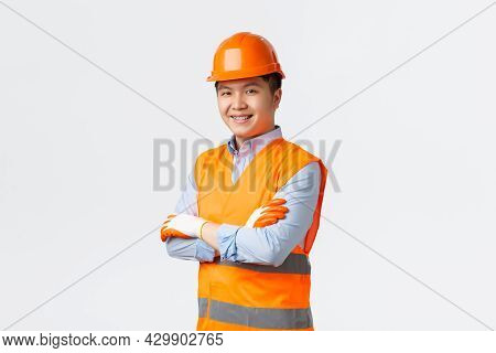 Building Sector And Industrial Workers Concept. Confident Young Asian Engineer, Construction Manager