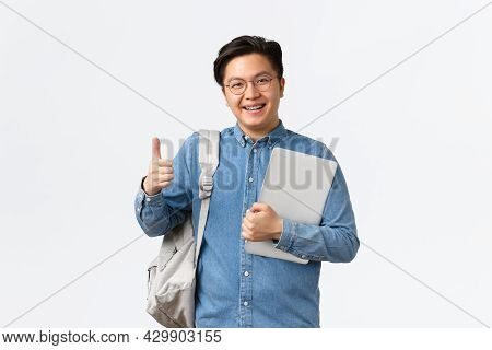 University, Study Abroad And Lifestyle Concept. Satisfied Happy Asian Male Student In Glasses And Sh