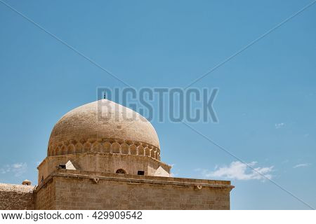 Dome Of Madrasah Opposite Summer Blue Sky. Kasimiye Medrese, Mardin, Turkey