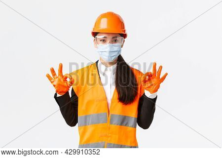 Covid-19 Safety Protocol At Enterpise, Construction And Preventing Virus Concept. Satisfied Asian Fe