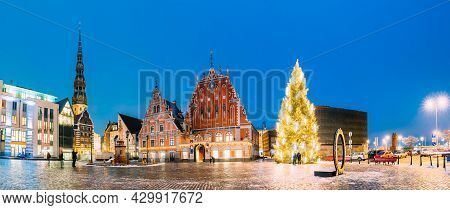 Riga, Latvia. Panorama Of Town Hall Square, Popular Place With Famous Landmarks On It In Bright Even