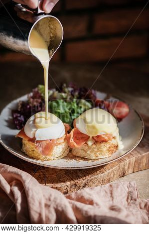 Eggs Benedict With Smoked Salmon, Hollandise Sauce On Bread, Close-up