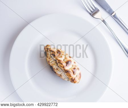Traditional Argentinian Food Called Empanada On A White Background