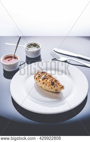 Traditional Argentinian Food Called Empanada In A Restaurant