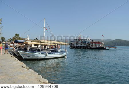 Boats and yachts at the in the marina of village Akyaka - slow city in Turkey.August 1,2021. Mugla,Turkey