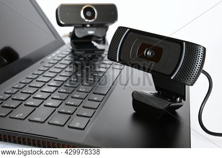 Black Computer Webcam On Notebook Keyboard. Smartwork Concept