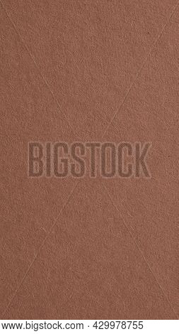 The Surface Of Brown Cardboard. Paper Texture With Cellulose Fibers. Vertical Spicy Mix Color Backgr
