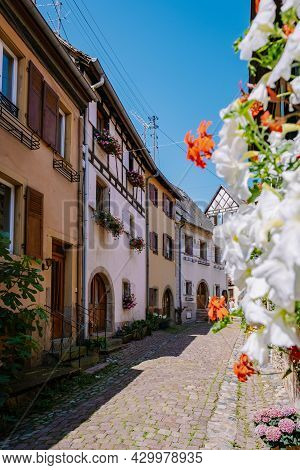 Eguisheim, Alsace, France, Traditional Colorful Halt-timbered Houses In Eguisheim Old Town On Alsace