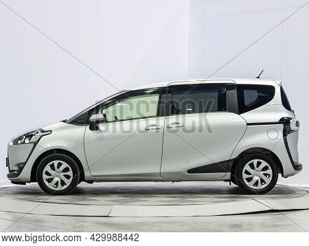 Novosibirsk, Russia - July 15, 2021:   Silver Toyota Sienta, Side View. Popular Car On A Parking