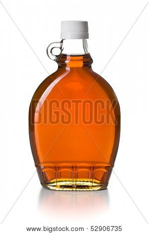 maple syrup in glass bottle on white background