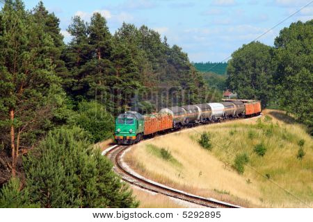 Freight Train Passing The Forest