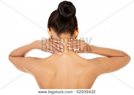 Naked woman doing neck self-examination from the back. Isolated on white. 