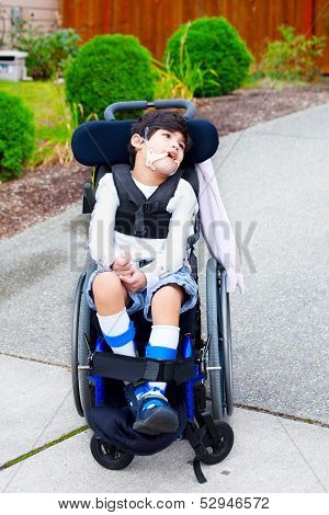 Seven Year Old Biracial Disabled Boy In Wheelchair