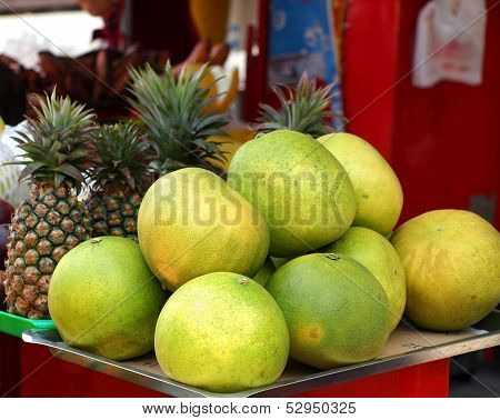 Large Pomelos And Pineapples