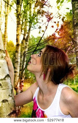Beautiful woman in a colorful magical nature