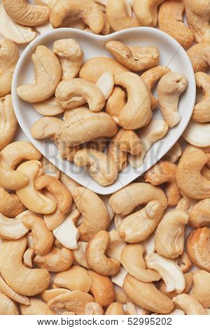 Cashew nut, healthy indian food ingredient in heart shaped tray