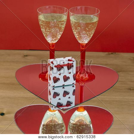 Champagne Glasses And Gift Box In Heart