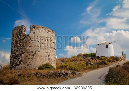 Two traditionnal old wind mills on MIlos island in Greece