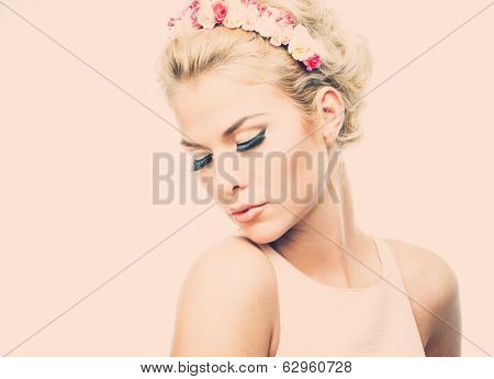 Beautiful young dreaming woman with chaplet 