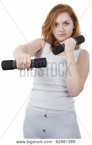 Portrait of woman with dumpbells