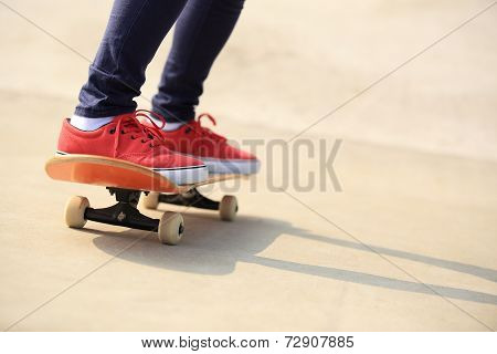 skateboarding woman legs at skatepark