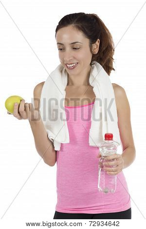 Fit Woman With An Apple And A Bottle Of Water With A Towel Around Her Neck