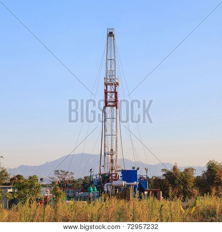 Oil Land Drilling Rig Working In The Field