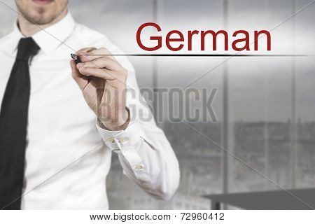 Businessman Writing German Translation In The Air