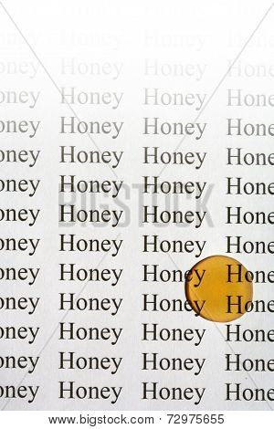 Drop of honey on paper