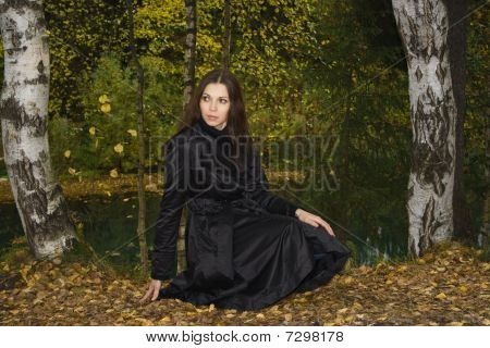 Woman In Autumn Park