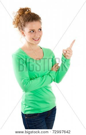 Three-quarter length of young Caucasian woman pointing