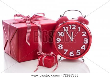 Christmas: big red gift box with red alarm clock - last minute christmas shopping