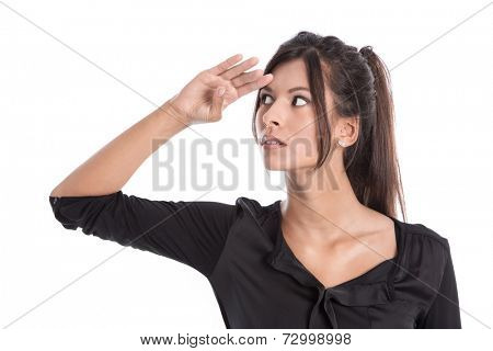 Isolated young business woman in a black blouse is looking in her future