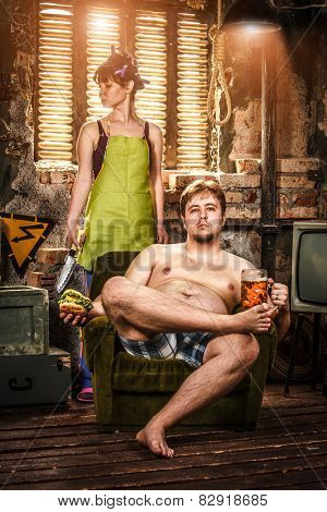 Family Life. Portrait of husband and wife in a poor slums room.