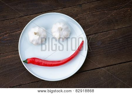 Smiley face made from pepper and garlic