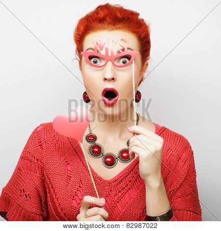 Attractive playful young woman ready for party - falce lips and glasses  