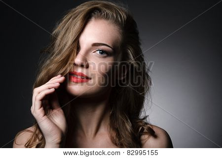 Beautiful caucasian young woman with red lips make up