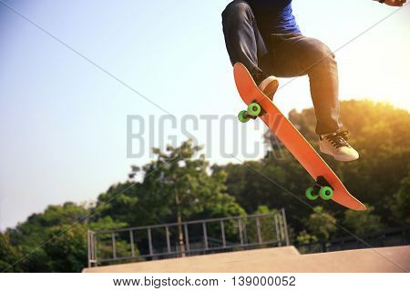 one young woman skateboarder skateboarding at skatepark