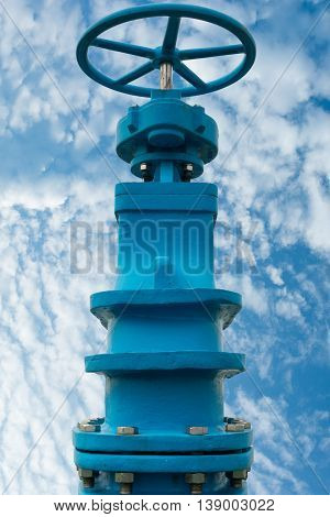 Control main valve on blue skies background Water control main valve Pipeline distribution Water pipeline distribution.