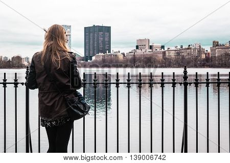 Girl On A Fence At Central Park In Manhattan, New York City