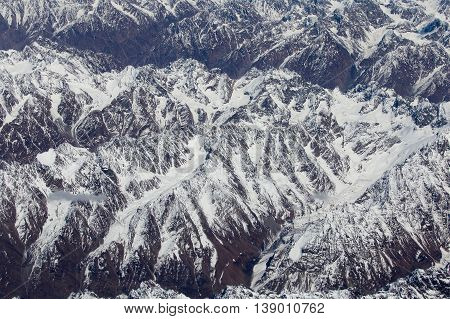Aerial views in Tibet fly over to mountain Himalaya . View from the plane window