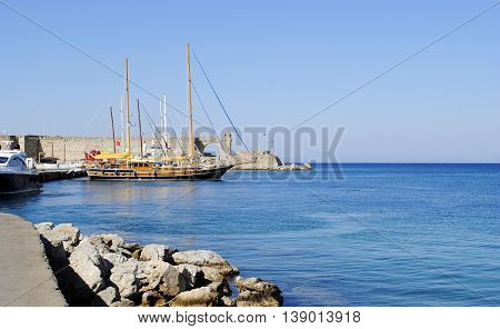 sailboat on the dock at the castle in Rhodes