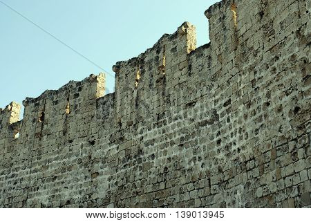 top medieval fortress wall in the city park in Rhodes