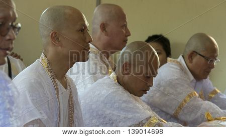 Man Who Will Become Buddhism Monk Sitting And Waiting For Ordination Ceremony