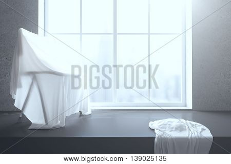 Chair under white piece of cloth on windowsill with blurry city view. 3D Rendering